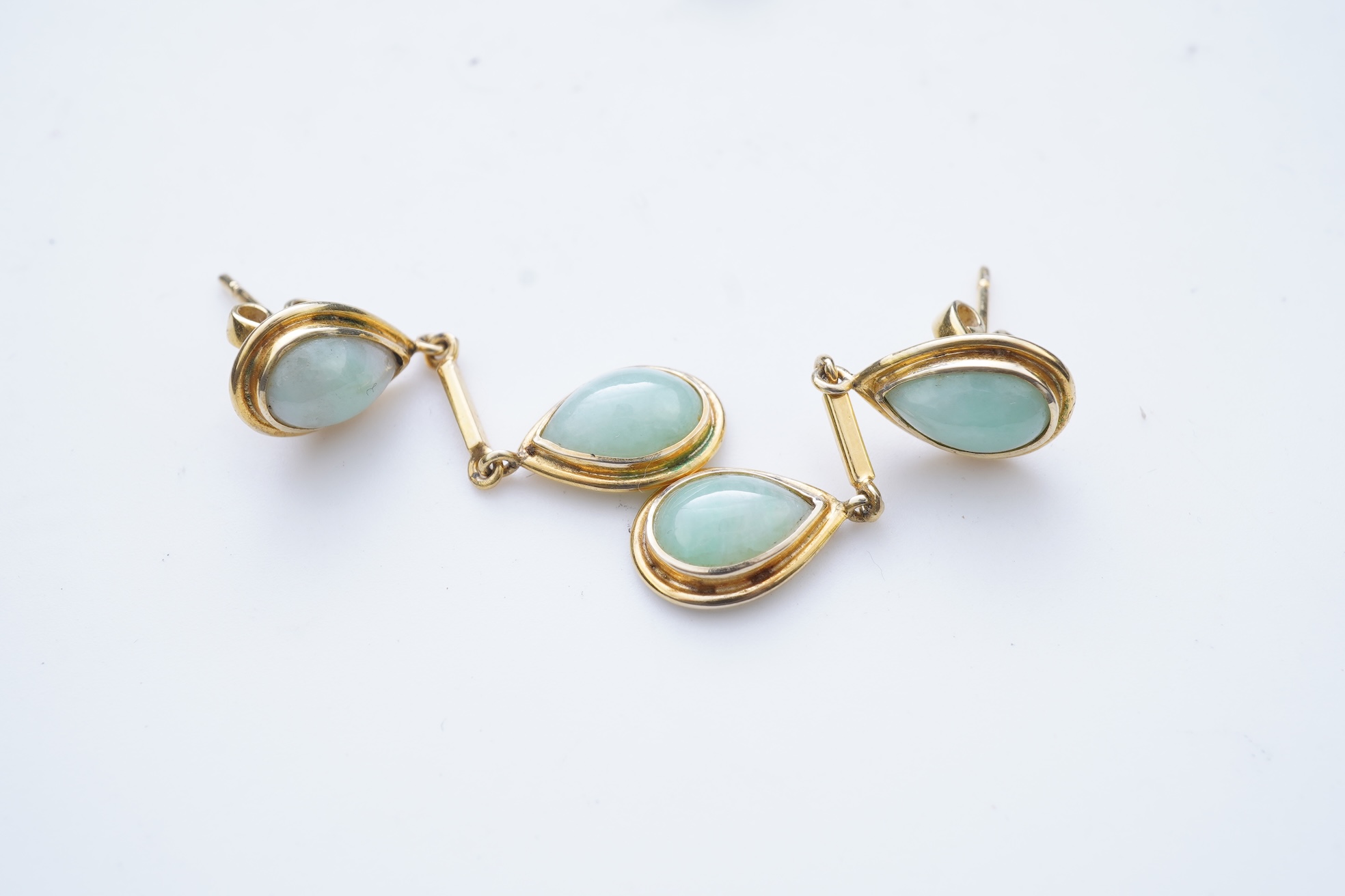 A jadeite pendant and pair of earrings